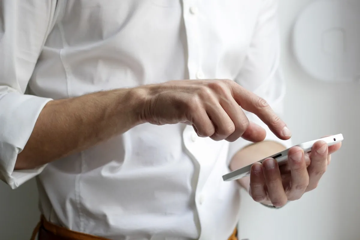 Person searching for services on a smartphone screen