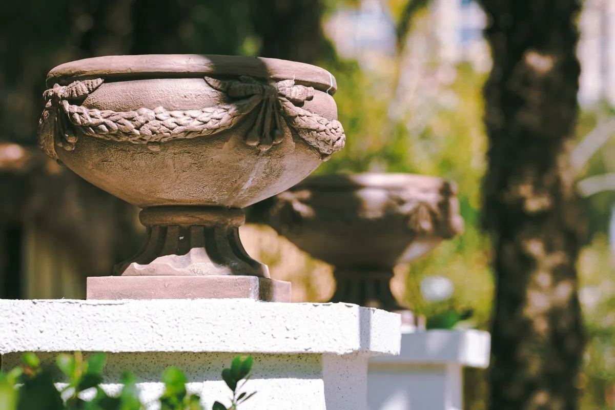 Elegant memorial urn display with warm lighting in a boutique showcase setting