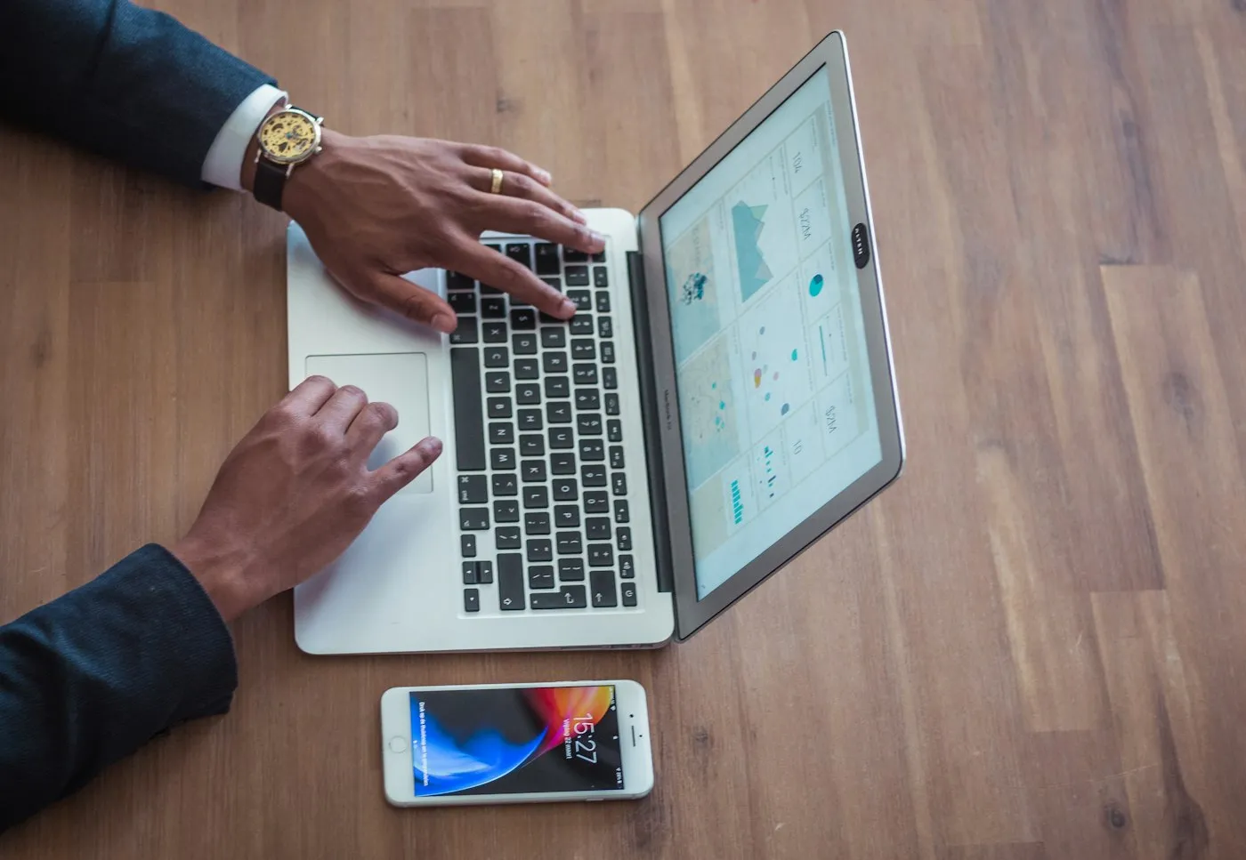 Person at a desk managing digital accounts and estate planning documents on a laptop