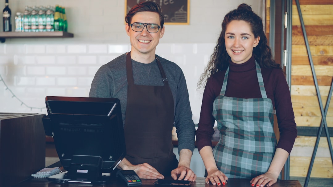 New funeral home owner reviewing digital marketing strategy on laptop with local search results visible