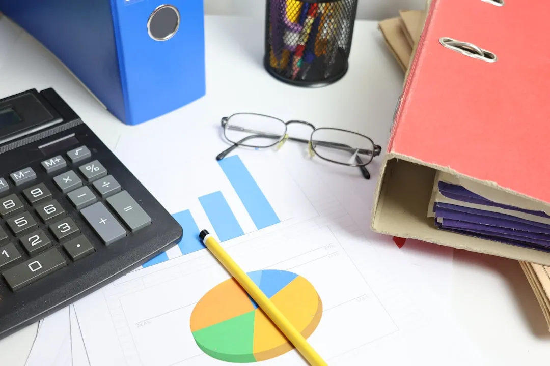 Payroll tax documents and W-2 forms on professional office desk