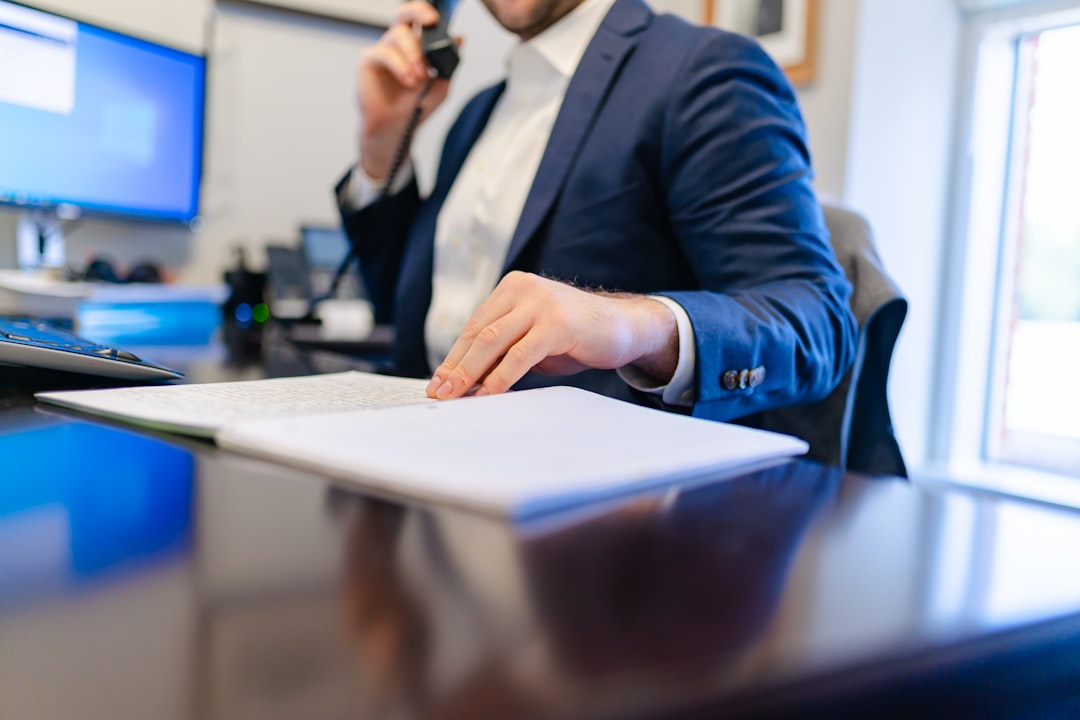 Insurance policy documents spread across a professional desk for review