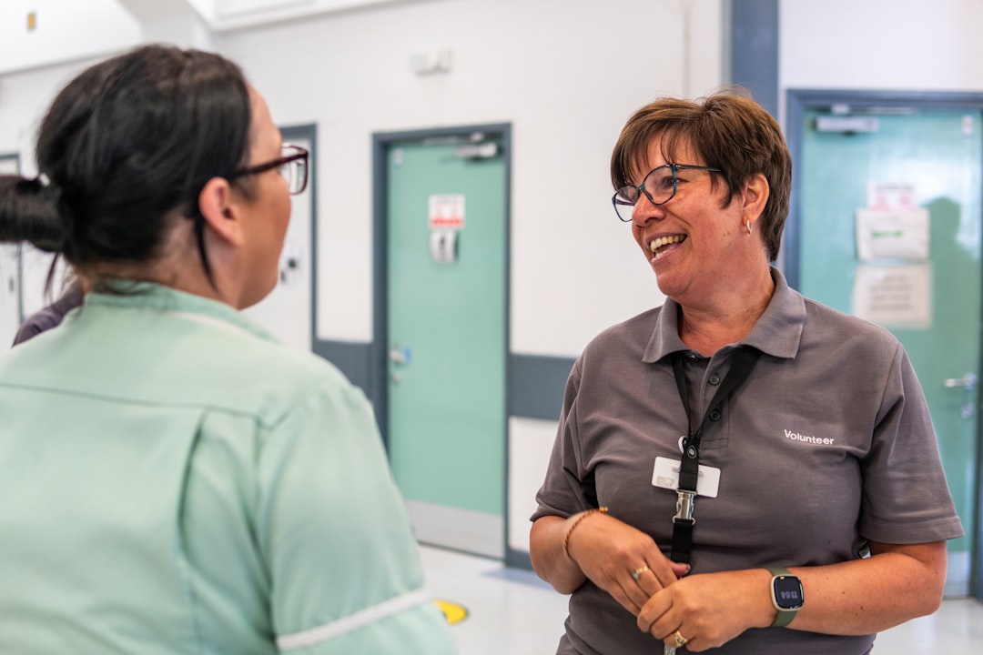 Healthcare professionals having a conversation in a hospital corridor