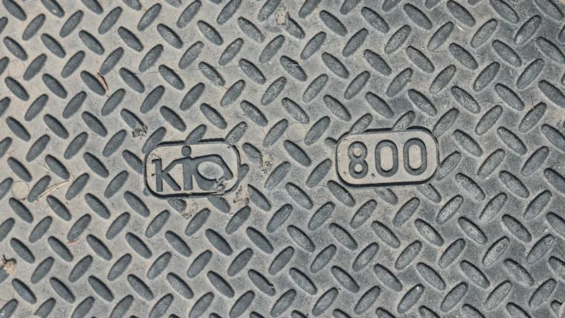 Equipment nameplate showing manufacturer data and serial number on industrial machinery