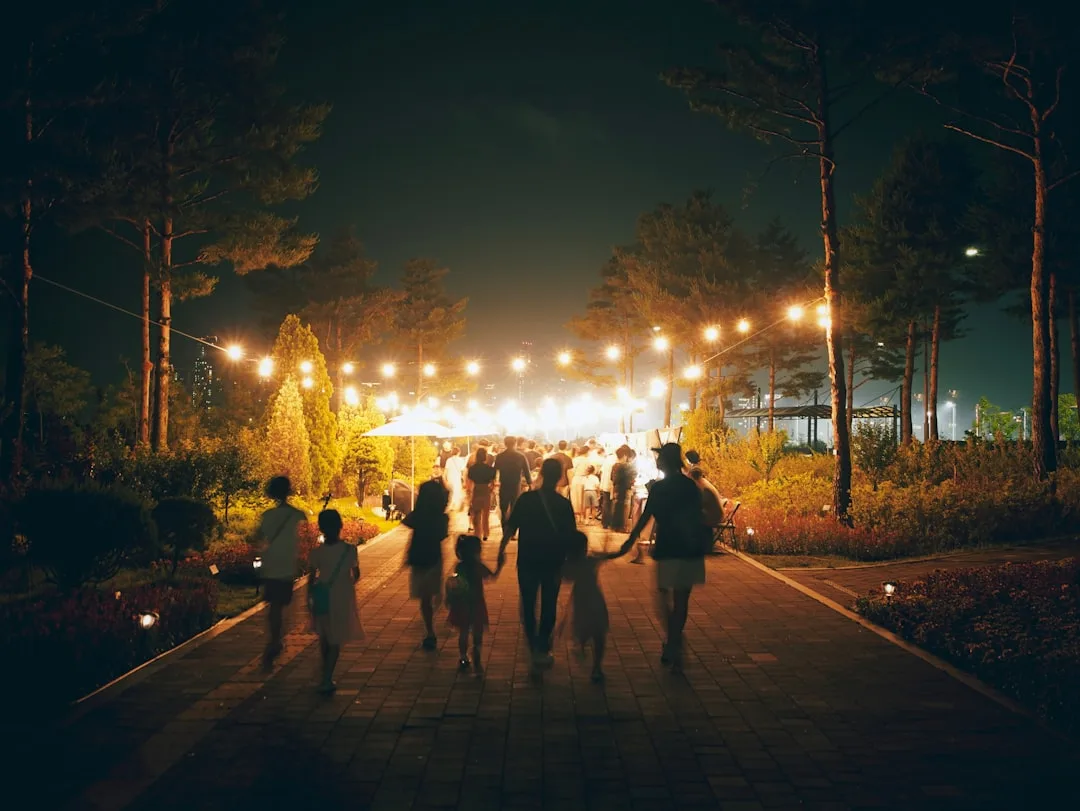 Family gathered outdoors for an informal celebration of life memorial in a park