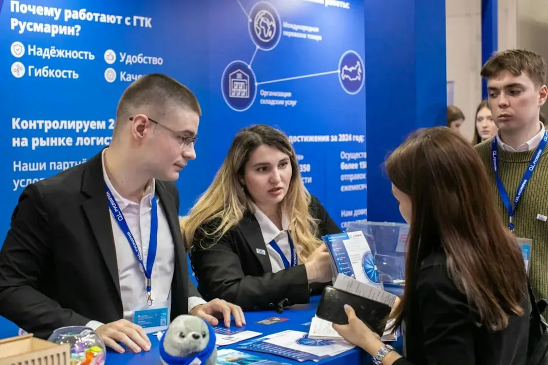 Business professionals networking at an expo vendor booth display
