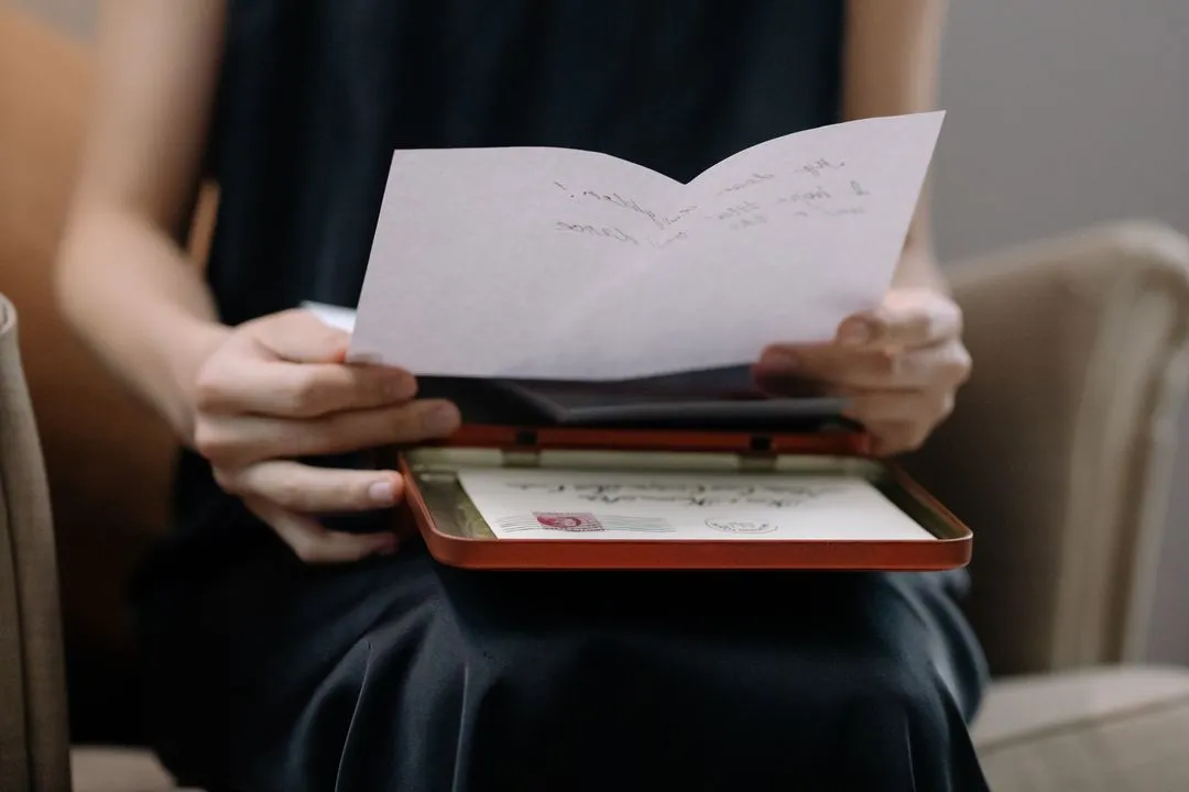Person reading official correspondence and mail at home